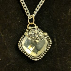 Beautiful clear glass necklace with decoration